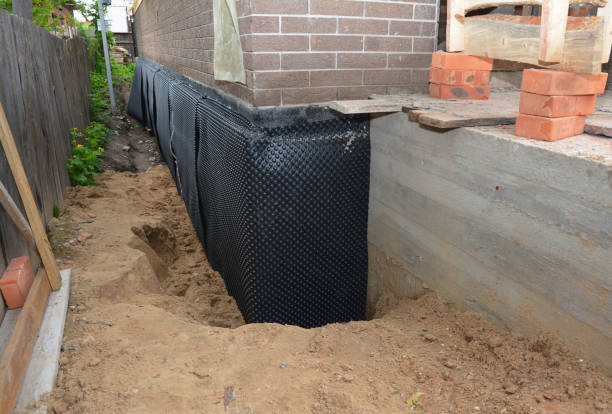 Happy homeowners after waterproofing job in Sassamansville